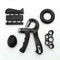 Black five-piece hand grip set with counting gripper, finger exerciser, grip ring, finger band and squeeze ball